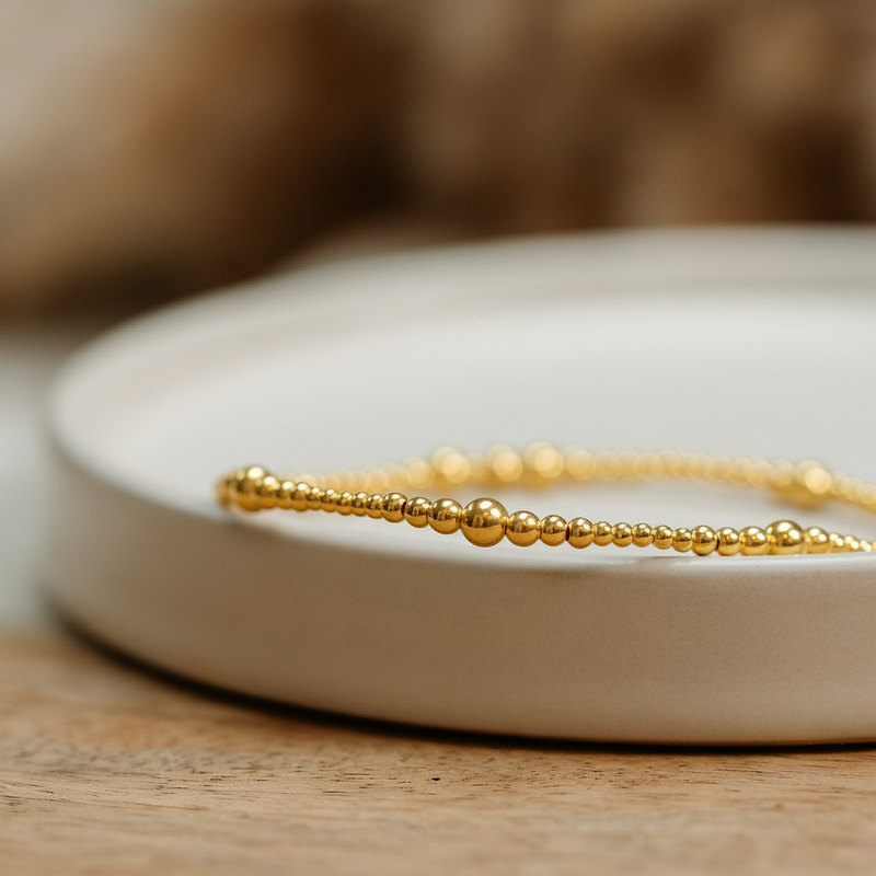 Bracelet on a white dish with a blurred background