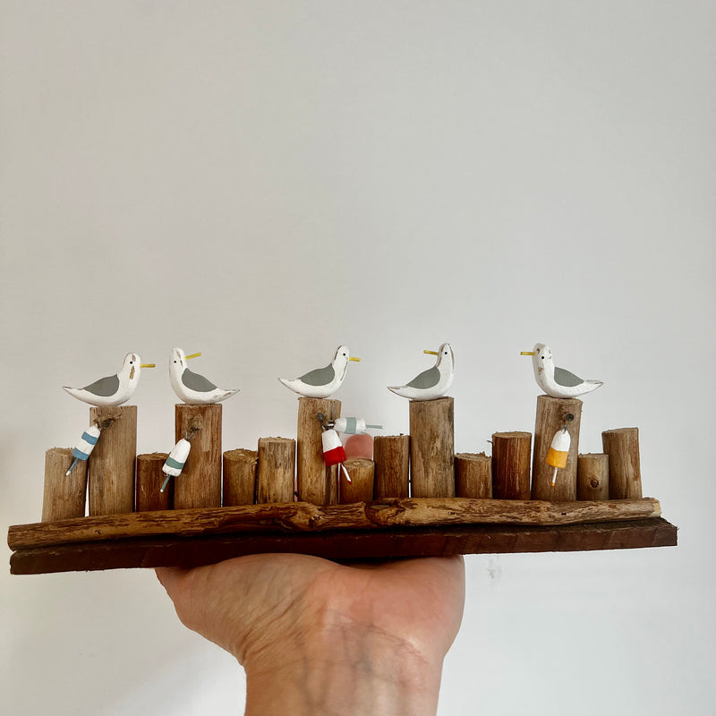 Long Row of Gulls and Bouys