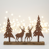 Decorative metal scene with two deer and two trees on a white background