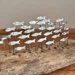 Silver Anchovies on Wood