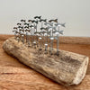 Silver Anchovies on Wood